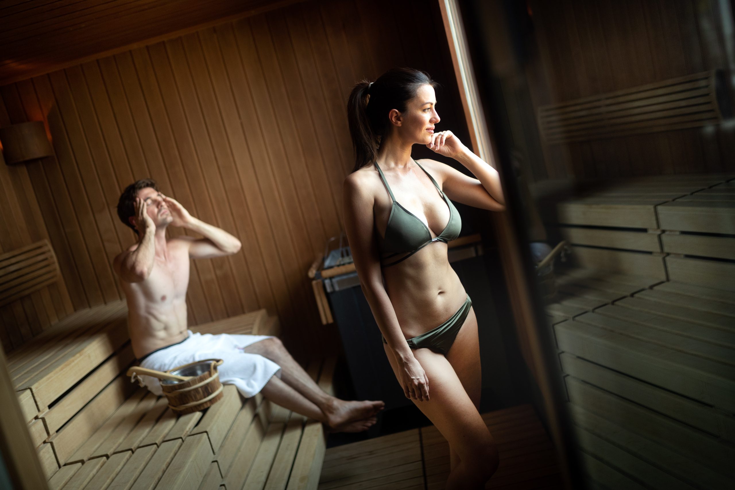 happy-couple-having-a-steam-bath-in-a-sauna